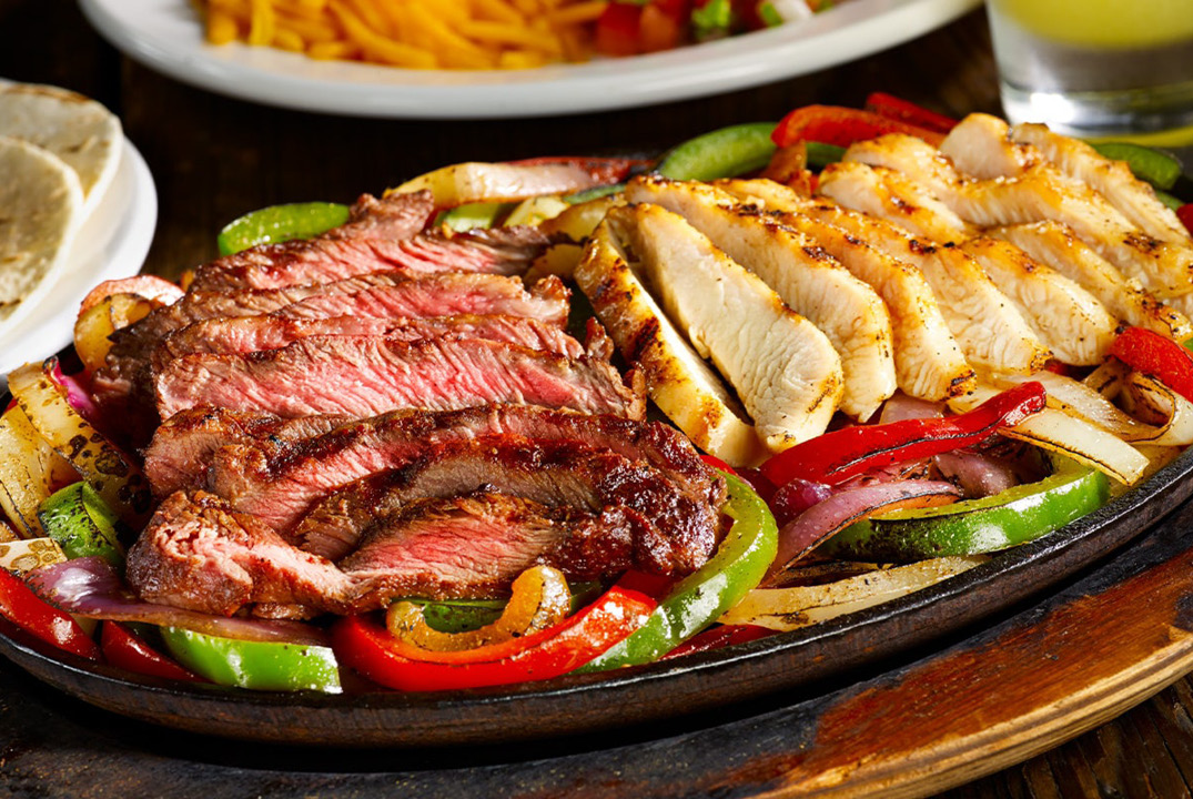 https://millersalehouse.com/wp-content/uploads/2021/06/Fajitas_Steak_Chicken_1075x720.jpg