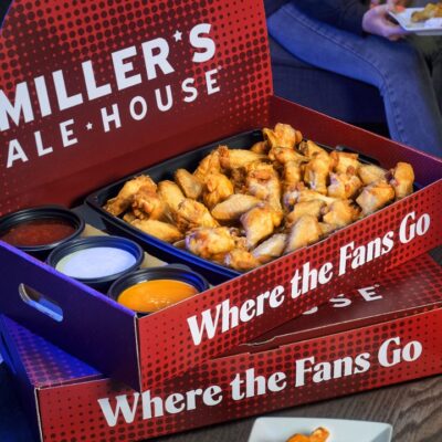 a large red miller's ale house branded box with chicken wings and sauces inside