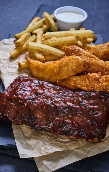 Half rack Barbecue Ribs, four Zingers® tossed in your choice of sauce, seasoned fries, coleslaw. Served with ranch