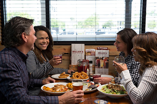 group of professionals enjoying lunch at millers