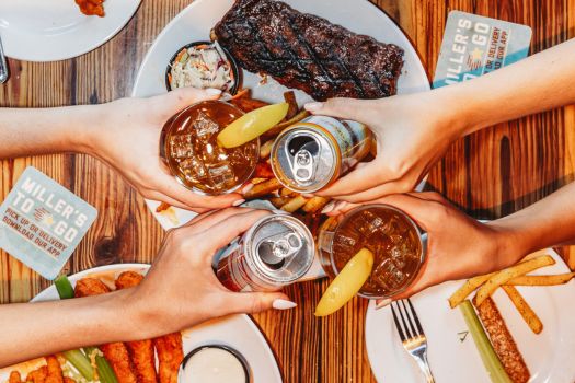 group of friends cheerings their drinks