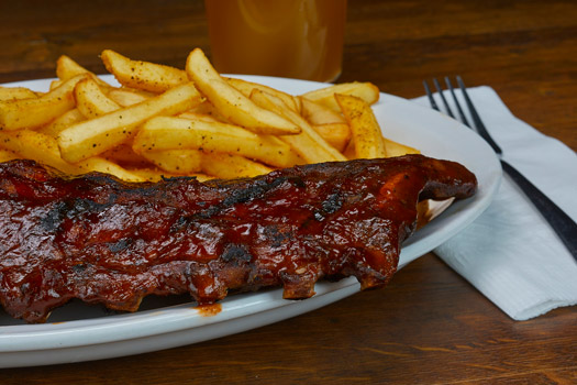a plate of barbecue ribs