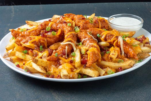 a plate of a zinger mountain melt which is chicken tenders, fries and cheese