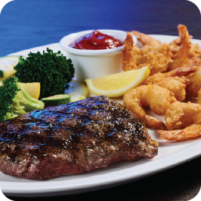 flat iron steak with fried shrimp on the side