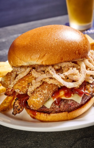 Premium ground beef patty, melted white American cheese, peppered bacon, bbq sauce, 3 Mozzarella Sticks, fried onion tanglers on a toasted bun.
